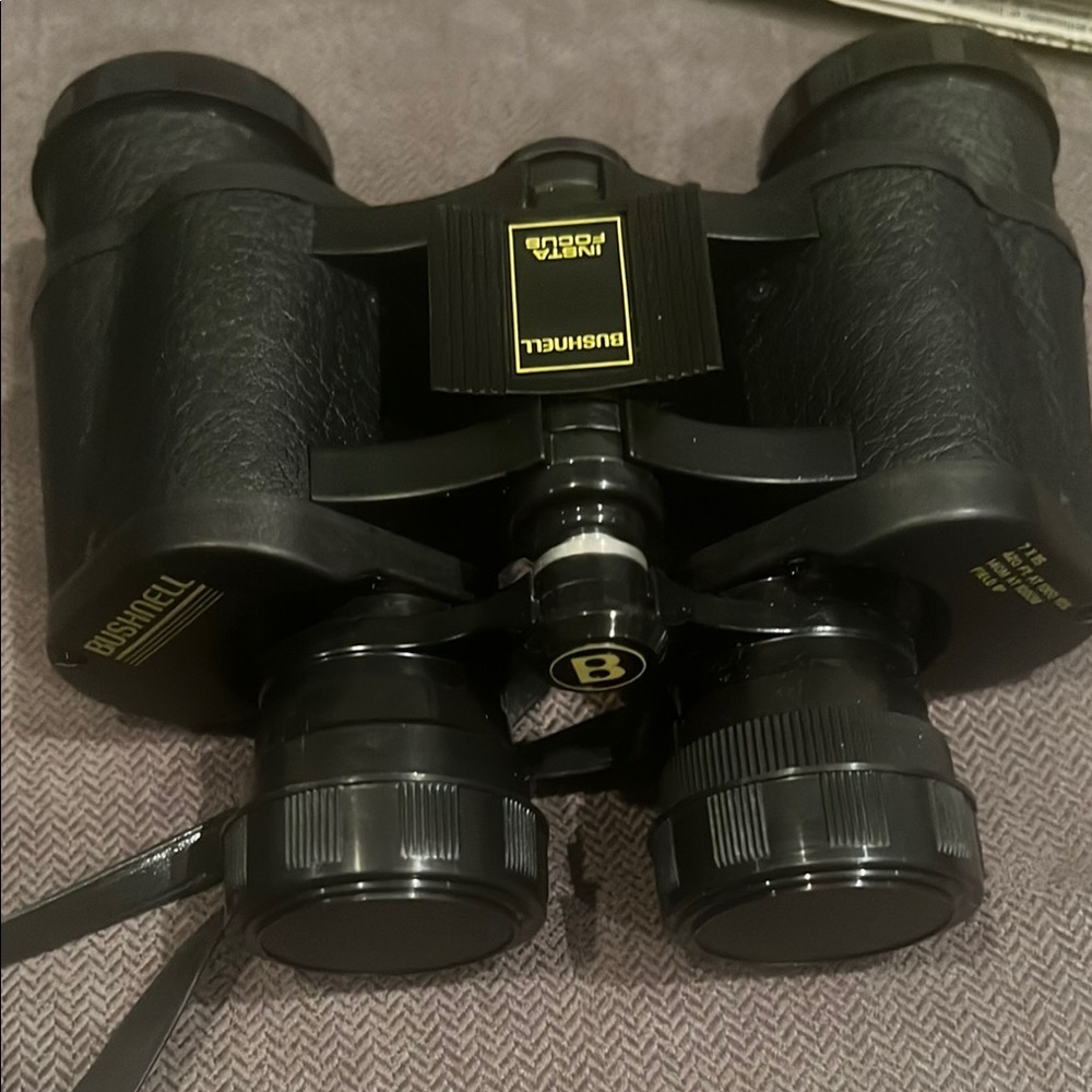 Black Bushnell Binoculars with Rubber Armor and Central Focus